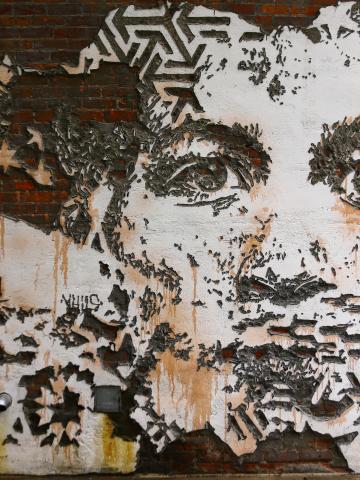 A piece of street art by artist VHILS called The Belt. Located in Detroit, Michigan.
